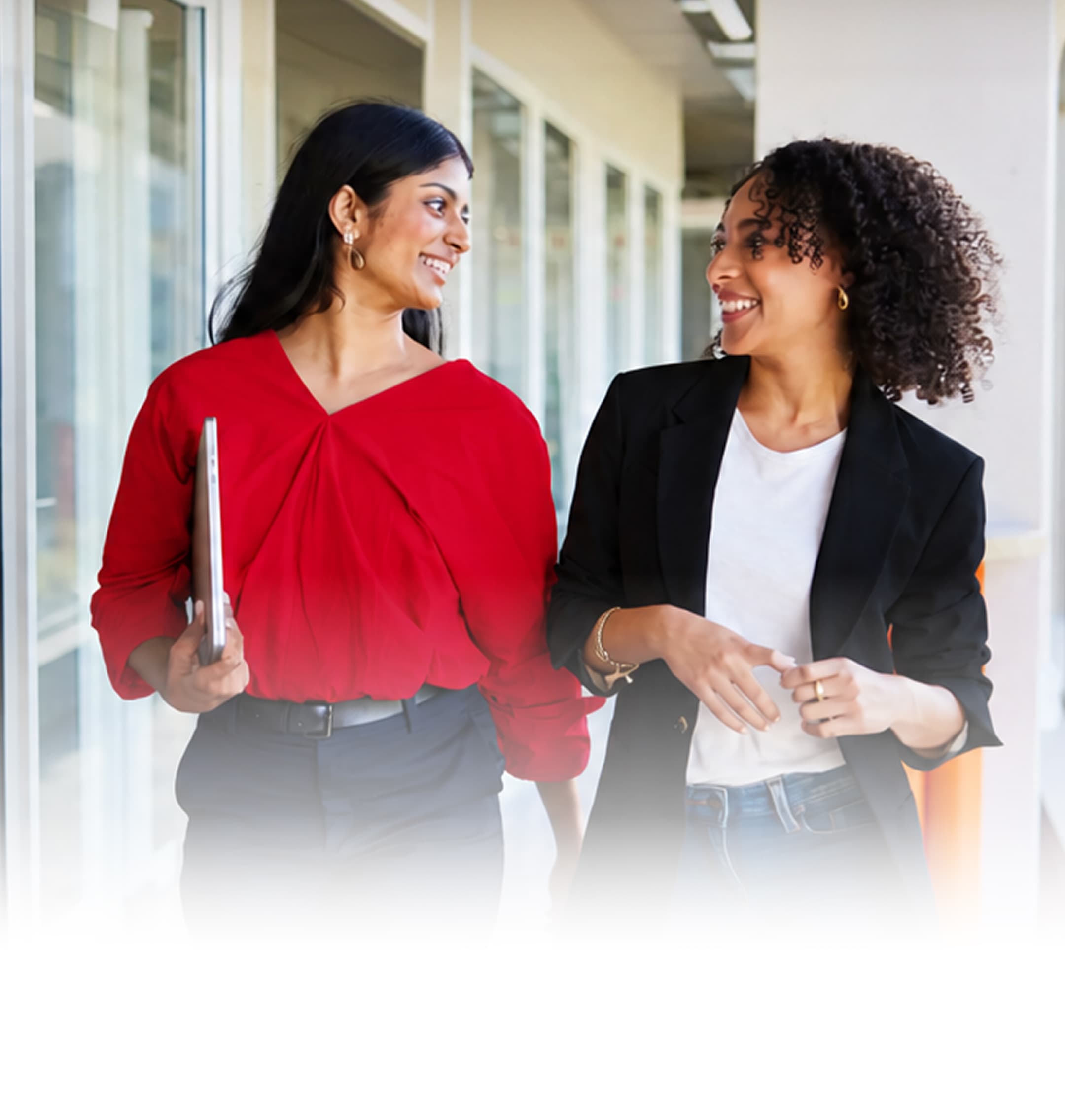 Mahindra team members walking together in an office