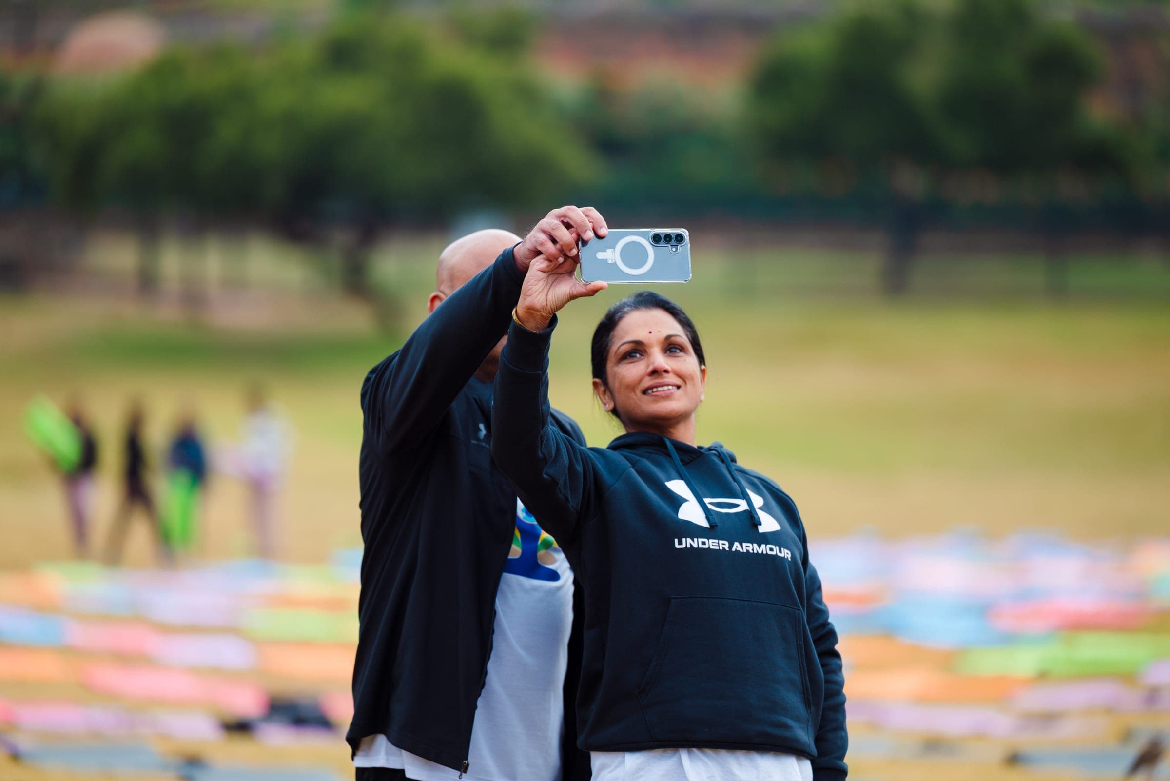 Attendees taking a selfie on the yoga mats at the Union Buildings lawns