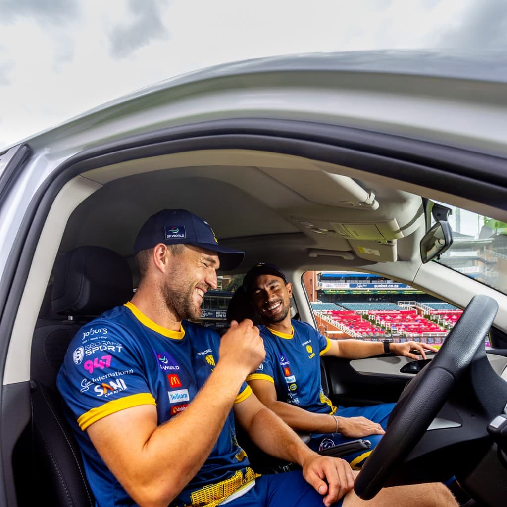 Lions Cricket players in a Mahindra vehicle